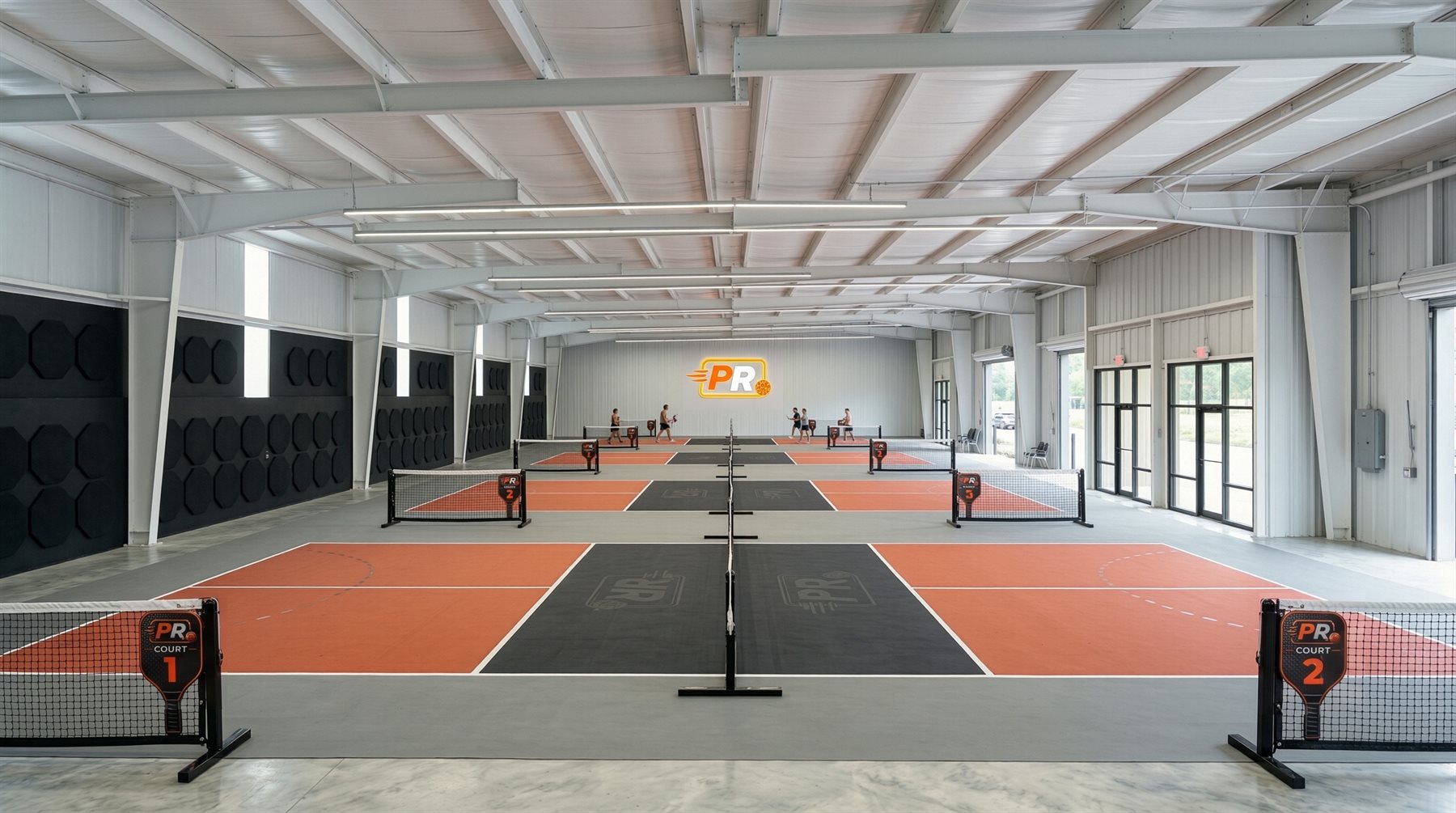 Wide view across the nine indoor courts